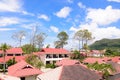 Tropical view over the red roof in a resort of Thailand with a beautiful sunny day Royalty Free Stock Photo