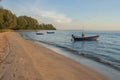 Tropical view of sea and fishing boats with sunset light at Chao Lao Beach. Royalty Free Stock Photo