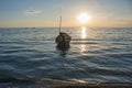 Tropical view of sea and fishing boats with sunset light at Chao Lao Beach. Royalty Free Stock Photo