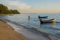 Tropical view of sea and fishing boats with sunset light at Chao Lao Beach. Royalty Free Stock Photo