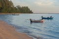 Tropical view of sea and fishing boats with sunset light at Chao Lao Beach. Royalty Free Stock Photo