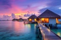 tropical water home villas resort at Maldives island at summer vacation, Picturesque summer sunset in Maldives. Luxury resort Royalty Free Stock Photo