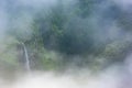 Tropical waterfall in the clouds, like heaven, Trou de fer, Reunion island, France Royalty Free Stock Photo