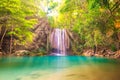 Tropical waterfall with emerald lake in jungle forest Royalty Free Stock Photo