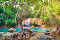 Tropical waterfall with emerald lake and rocks in jungle forest Royalty Free Stock Photo