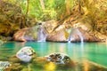 Tropical waterfall with emerald lake and rocks in jungle forest Royalty Free Stock Photo