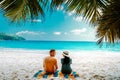 Tropical white beach at Praslin island Seychelles, happy Young couple man and woman during vacation Holiday at the beach Royalty Free Stock Photo