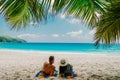 Tropical white beach at Praslin island Seychelles, happy Young couple man and woman during vacation Holiday at the beach Royalty Free Stock Photo