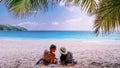 Tropical white beach at Praslin island Seychelles, happy Young couple man and woman on the beach Royalty Free Stock Photo