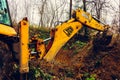 Trostyanets, Ukraine December 20, 2019: excavator digs soil in a village in a private yard. Royalty Free Stock Photo