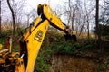 Trostyanets, Ukraine December 20, 2019: excavator digs soil in a village in a private yard. Royalty Free Stock Photo