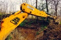 Trostyanets, Ukraine December 20, 2019: excavator digs soil in a village in a private yard Royalty Free Stock Photo