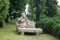 TROSTYANETS/UKRAINE, JULY 06, 2017: pagan Scythian statue of a woman, next to the bench Royalty Free Stock Photo