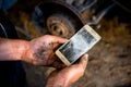 Trouble in the car service worker - broke the smartphone Royalty Free Stock Photo