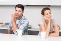 Troubled couple having coffee not talking to each other