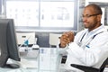 Troubled doctor sitting at desk