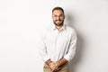 Troubled man having bladder problem, need toilet, standing over white background Royalty Free Stock Photo