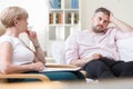 Troubled man talking with psychologist Royalty Free Stock Photo