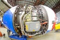 Troubleshooting the engine with an open hood of the aircraft in the aircraft hangar, mechanical repair close up view, checking all