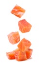 Trout cubes fall on a pile on a white background. Isolated