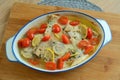 Trout fillets baked with butter, tomatoes