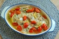 Trout fillets baked with butter, tomatoes
