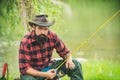 Trout on a hook. Man fly fishing. Brown trout being caught in fishing net. Fly fisherman using fly fishing rod in Royalty Free Stock Photo