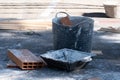 Various masonry and brickwork tools being used on a construction site