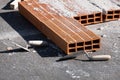 Various masonry and brickwork tools being used on a construction site