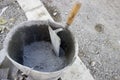 Trowel and bucket with cement