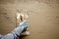 Trowel with glove hand plastering cement mortar Royalty Free Stock Photo