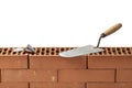 Trowel and a Plumb Bob on a Wall of Bricks Royalty Free Stock Photo