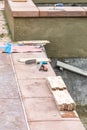 Trowels and New Tile At Pool Construction Site Royalty Free Stock Photo