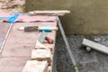 Trowels and New Tile At Pool Construction Site Royalty Free Stock Photo