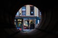 Troy NY USA - Local business and cafe view through pipeline artwork.