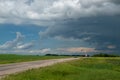 Truck approaching with looming storm clouds, Saskatchewan, Canad Royalty Free Stock Photo