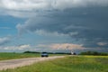 Truck approaching with looming storm clouds, Saskatchewan, Canad Royalty Free Stock Photo