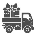 Truck with a big gift solid icon, shopping concept, delivery truck with a big gift sign on white background, cargo truck Royalty Free Stock Photo