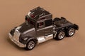 Truck without the body on brown background - miniature metal toy