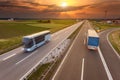 Truck and bus in motion blur on the highway at sunset Royalty Free Stock Photo