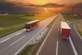 Truck and bus in motion blur on motorway at sunset Royalty Free Stock Photo