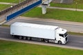 Truck cargo van on motorway under bridge in motion. Big commercial cargo van, freight car. Branding mockup Royalty Free Stock Photo