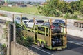 Truck carrying brand new daihatsu cars