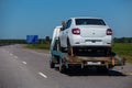 Truck carrying a car .Assistance on roads.