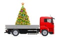 Truck with Christmas tree. Gift delivery concept, 3D rendering Royalty Free Stock Photo