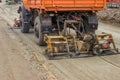 Truck compacting gravel at road construction site 2