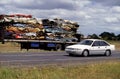 Truck with Compressed Cars going for Steel Recycling