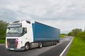 Truck with container on highway, cargo transportation concept. Logistics and warehouse transportation