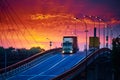 Truck with container rides over the bridge, beautiful sunset, freight cars in industrial seaport, the road goes up