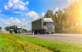 Truck convoy delivers goods on a country road Royalty Free Stock Photo